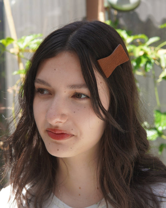 Women wearing a vintage teak design hair clip